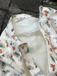 Close-up of the internal pocket and lining of the cotton canvas dog print tote bag