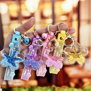 Creative star-shaped glitter liquid keychains with colorful silicone straps and bells