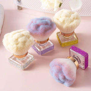 Detailed view of luxury rhinestone-encrusted rose-shaped makeup and nail dust brushes