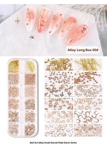 Macro detail of mixed gold nail art alloy charms in 12-grid organizer box and nail application