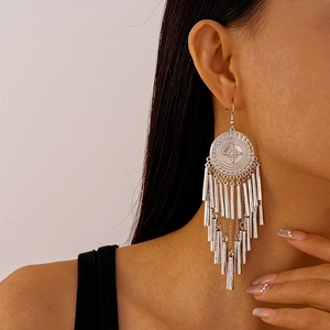 Bohemian silver geometric round earrings with long metal tassel fringe on model