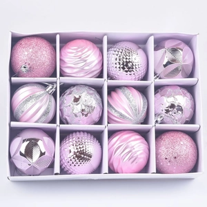 Top view of 12 mixed texture pink Christmas ornaments in a white grid display box