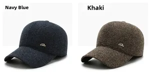Detailansicht der Woll-Basecaps in Marine und Khaki mit strukturiertem Fischgrätmuster