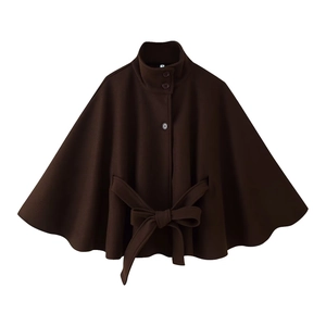 Detail of dark brown wool jacket featuring stand collar, round button and tied waist belt