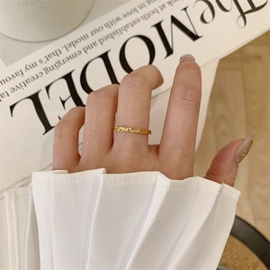 Minimalist 18K gold plated stainless steel ring with starburst engraving texture