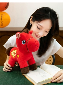 Detail view of a vibrant red plush horse mascot toy for Year of the Horse gift