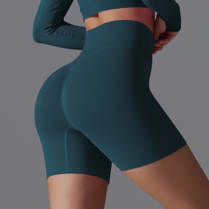 Detail view of teal high-waist seamless yoga shorts with scrunch butt lifting design