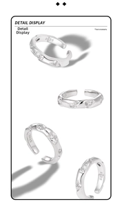 Detailed view of S925 sterling silver ring with crushed texture and inset zircons