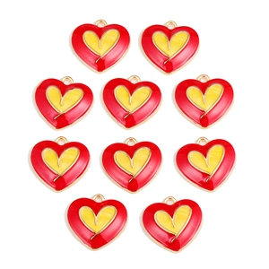Set of 10 red and yellow heart-shaped enamel pendants with gold metal borders