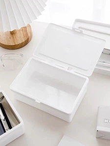 White plastic desk organizer with lid showing internal storage space for stationery