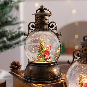 Detail of vintage Christmas lantern water globe with Santa Claus and sparkling snow