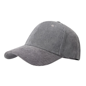 Close-up detail of grey corduroy baseball cap showing textured fabric and stitching