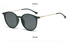 Detail view of round green frame sunglasses with slim gold metal temples from 45 degree angle