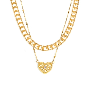 Double-layered gold heart necklace featuring a cutout pendant with a central sparkling stone