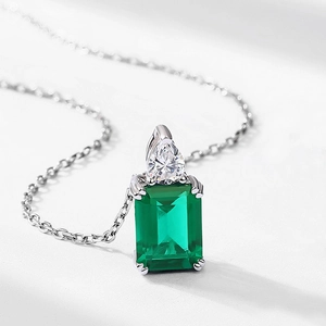 Vintage emerald-cut green gemstone pendant in S925 silver with teardrop zircon accent