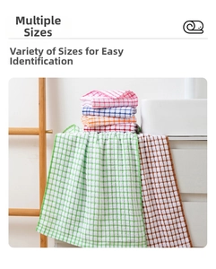 Macro detail of colorful checkered cotton tea towels in various vibrant woven patterns