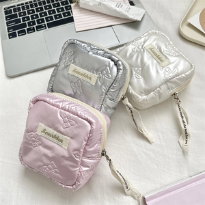 Quilted bow mini pouch set in pink, silver, and white with satin finish and zipper