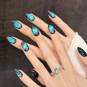 Starry Night gradient blue cat eye almond press-on nails with shimmering cosmic glitter