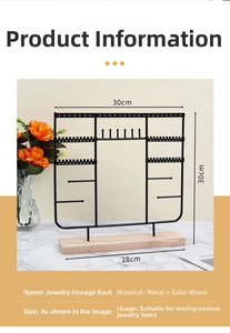 Detail view of black metal jewelry organizer with wood base and size 30x30cm