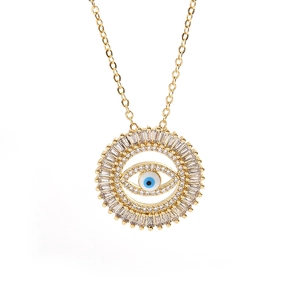 Macro shot of gold-plated evil eye necklace featuring rectangular crystal embellishments