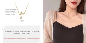 Macro view of gold heart EKG pendant necklace with zircon detailing on female model
