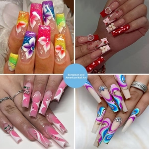 Long coffin press-on nails featuring floral patterns, strawberry art and 3D charms