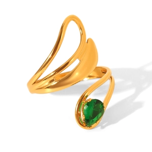 Detailed view of gold plated ring featuring a pear cut green zircon and polished finish