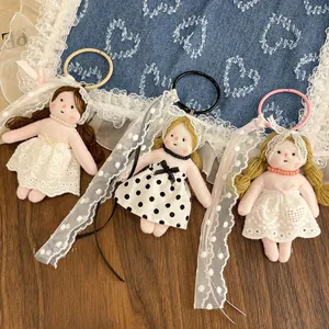 Detailed trio of floral doll charms with lace dresses and vintage pearl necklace accents