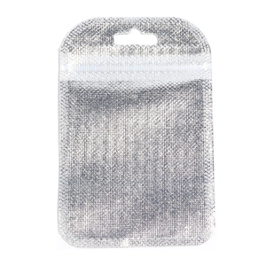 Detail of silver foil zip lock bag with metal grid texture and top hanging hole