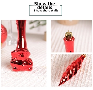 Detailed view of red electroplated Christmas ornaments with cartoon shapes and hanging hooks