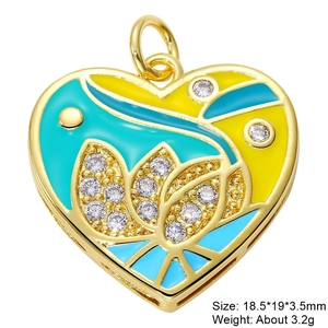 Detailed macro view of yellow and blue heart pendant with zircons and size specifications