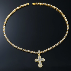 Detailed view of hip hop gold cross pendant necklace with sparkling pavé crystals