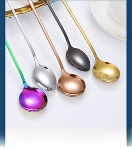 Polished stainless steel long handle spoons in five vibrant colors displayed on a white plate