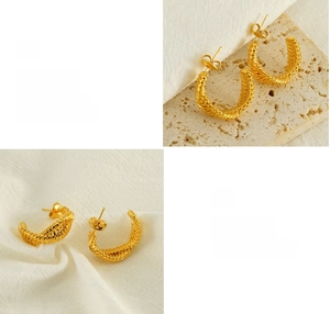 Macro shot of gold twisted hoop earrings with textured spiral design and polished finish