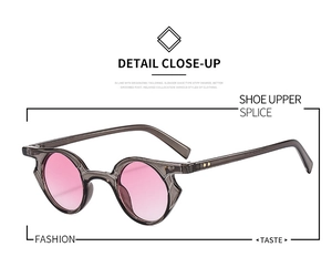 Dettaglio della montura grigia e lenti rosa sfumate su occhiali da sole stile punk
