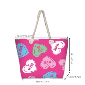 Pink canvas beach tote bag with heart patterns and thick rope handles for women