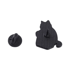 Back view of a cat-shaped metal badge with a black rubber pin clutch on white background