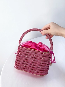 Luxurious magenta beaded bucket bag with drawstring satin lining and woven handle