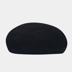 Detail shot of black rabbit fur beret showing soft wool texture and minimalist style