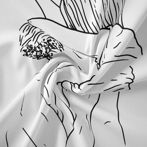 Detailed view of the spiral fold texture and black line art on the minimalist wall tapestry