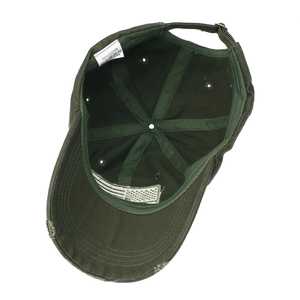 Interior view of olive green cotton baseball cap with American flag label and metal buckle