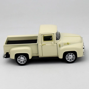 Side view of a vintage cream metal pickup truck model with realistic rubber tires