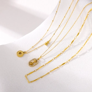 Chinese style minimalist gold necklace set featuring Pingan character pendant with zircons