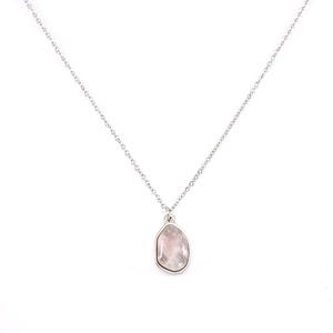 Close-up of irregular pink natural stone pendant with gold plated stainless steel chain