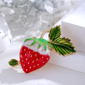 Cute strawberry brooch with red enamel and gold trim for cardigans and dresses