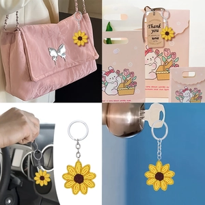 Sunflower beaded keychain on a handbag and gift bag showing multiple uses