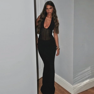 Detail of sexy backless halter maxi dress with black mesh panels and sheer cutouts