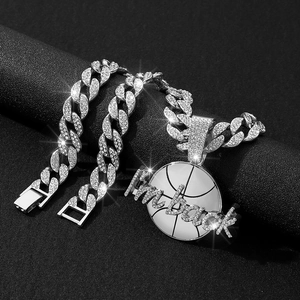 Detail of silver iced-out Cuban chain with I'm back basketball letter pendant