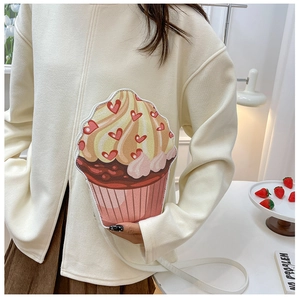 Cute cupcake crossbody bag for women featuring creamy frosting and heart detail on model