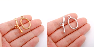 Macro detail of 18k gold and silver stainless steel OT toggle clasps for jewelry making